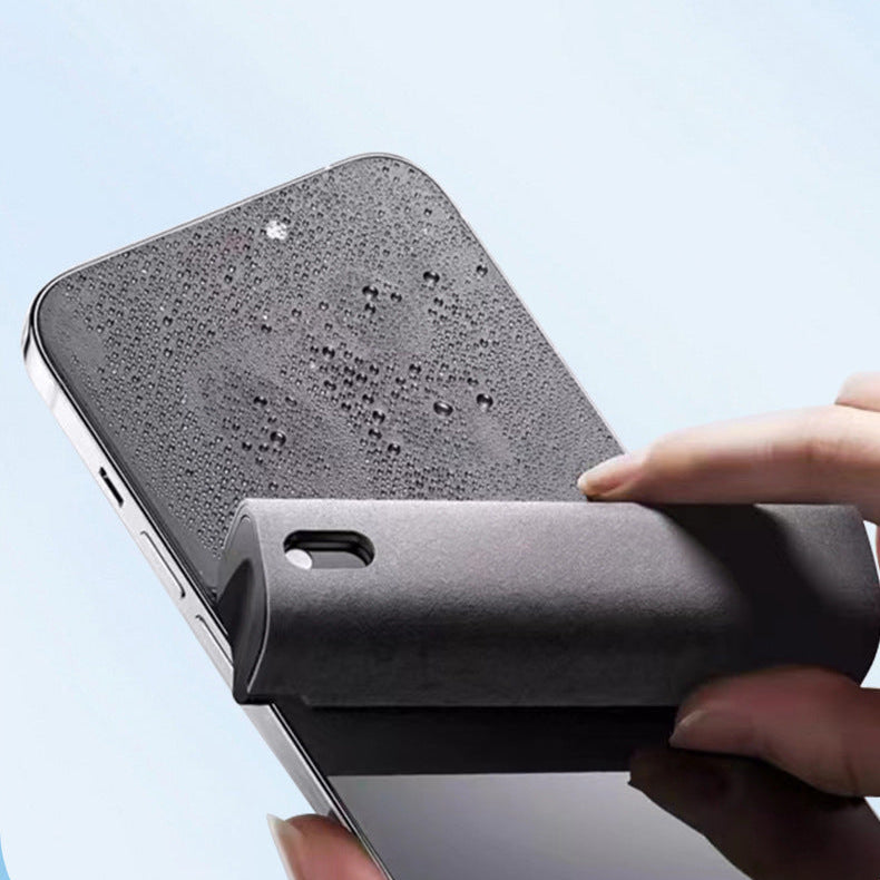 Person holding a smartphone with a black protective case on a light blue background